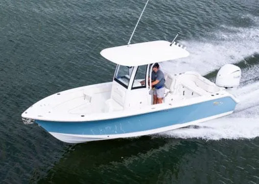Slide: The Image of 2025 Sea Hunt Ultra 245 SE boat cruising on open water. - 20