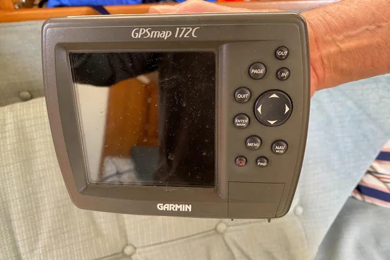 Slide: The Image of Garmin GPSmap 172C device held, associated with a 1992 Catalina 30 MkII sailboat. - 12