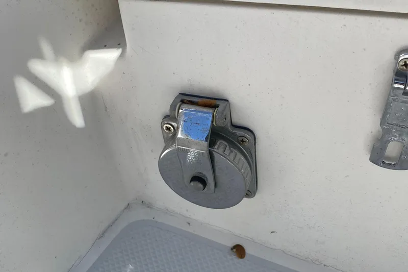 Slide: The Image of Metallic fixture on a 1992 Catalina 30 MkII boat, mounted on a white surface. - 20