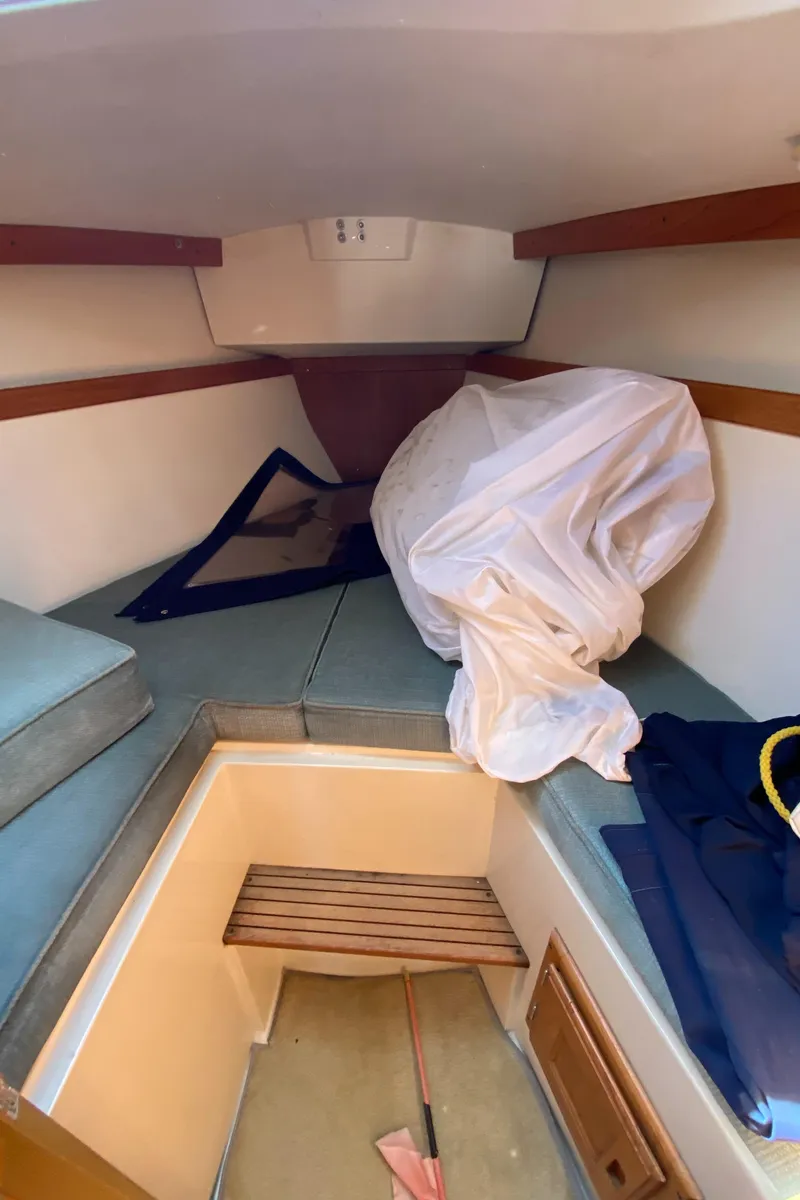 Slide: The Image of Interior of 1992 Catalina 30 MkII sailboat with cushions and storage space. - 24
