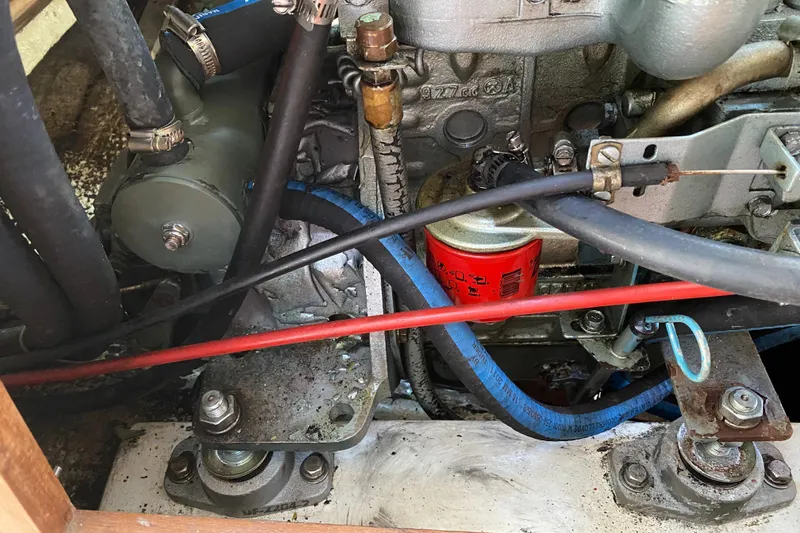 Slide: The Image of Engine compartment of a 1992 Catalina 30 MkII sailboat, showing hoses and components. - 26