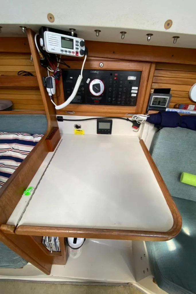 Slide: The Image of Navigation station of a 1992 Catalina 30 MkII sailboat with control panel and radio equipment. - 27