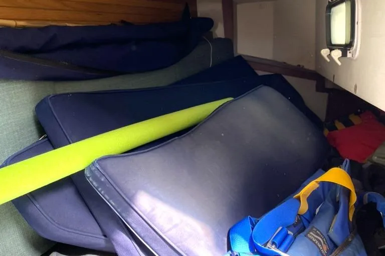 Slide: The Image of Cushions and gear inside a 1992 Catalina 30 MkII sailboat cabin. - 29
