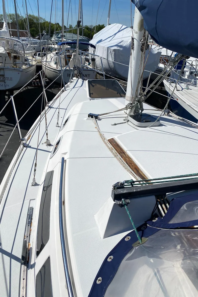 Slide: The Image of 1992 Catalina 30 MkII sailboat deck view, docked in a marina. - 5