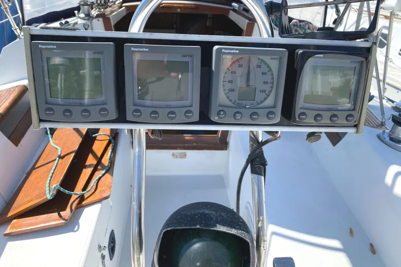 Slide: The Image of Cockpit of 1992 Catalina 30 MkII sailboat with navigation instruments and compass. - 7