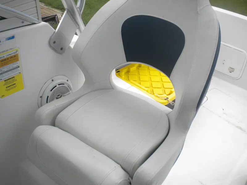 Slide: The Image of Boat seat on 2003 Pro-Line 23 Walk, featuring white and blue design. - 11