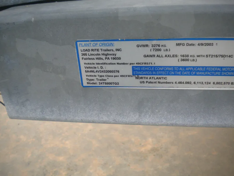 Slide: The Image of Label on a 2003 Pro-Line 23 Walk trailer, detailing specifications and compliance information. - 27