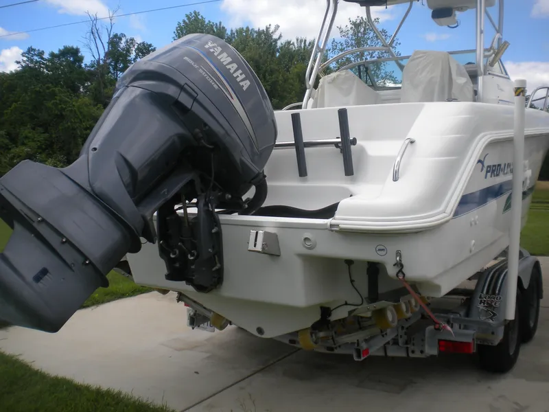 Slide: The Image of 2003 Pro-Line 23 Walk boat with Yamaha outboard motor on trailer. - 4