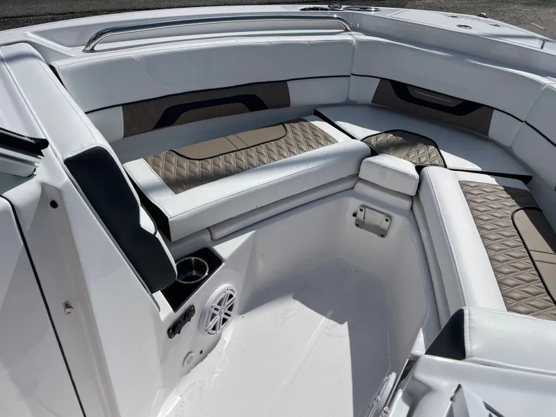 Slide: The Image of 2024 Blackfin 232DC boat interior with cushioned seating and modern design. - 15