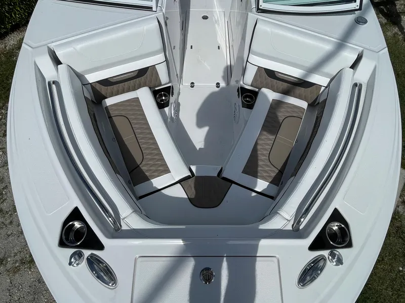 Slide: The Image of 2024 Blackfin 232DC boat interior with cushioned seating and sleek design. - 17