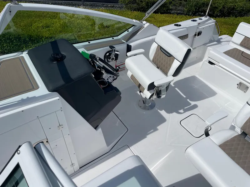 Slide: The Image of 2024 Blackfin 232DC boat interior with modern seating and steering console. - 19