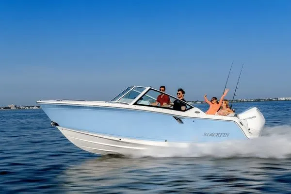 Slide: The Image of 2024 Blackfin 232DC boat cruising on open water with passengers enjoying the ride. - 38