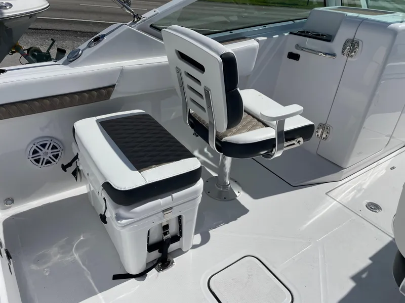 Slide: The Image of 2024 Blackfin 232DC boat interior with seating and storage. - 9