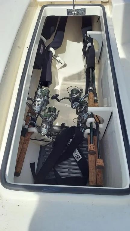 Slide: The Image of 2023 Pathfinder 2300 HPS boat rod storage with fishing rods secured inside. - 20