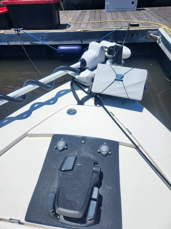 Slide: The Image of 2023 Pathfinder 2300 HPS boat with advanced navigation equipment docked at a marina. - 22