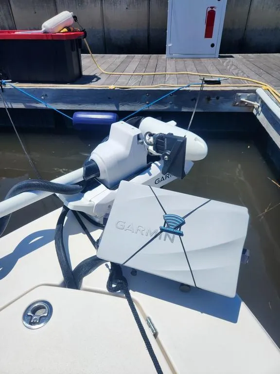 Slide: The Image of 2023 Pathfinder 2300 HPS boat with Garmin marine electronics at dock. - 23