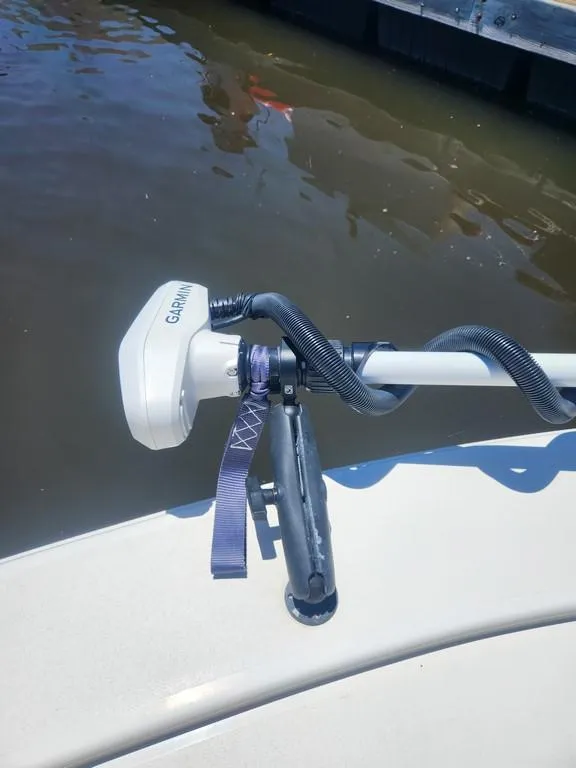 Slide: The Image of 2023 Pathfinder 2300 HPS boat with Garmin equipment on deck by the water. - 24