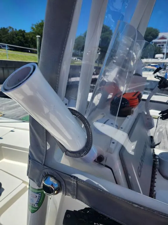Slide: The Image of 2023 Pathfinder 2300 HPS boat interior with rod holder and Garmin equipment. - 26
