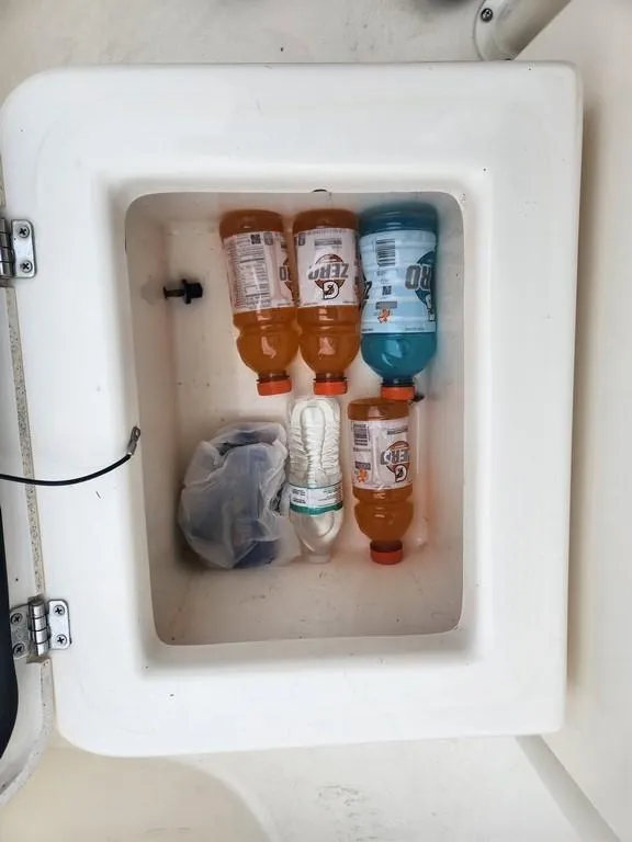 Slide: The Image of Cooler on 2023 Pathfinder 2300 HPS boat with drinks and snacks inside. - 36