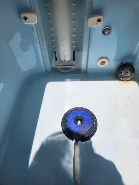 Slide: The Image of 2023 Pathfinder 2300 HPS boat interior with blue fittings and drainage system. - 38