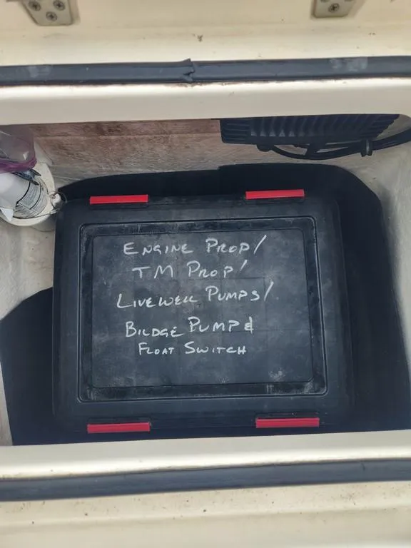 Slide: The Image of Storage compartment in 2023 Pathfinder 2300 HPS boat with labeled equipment box. - 41