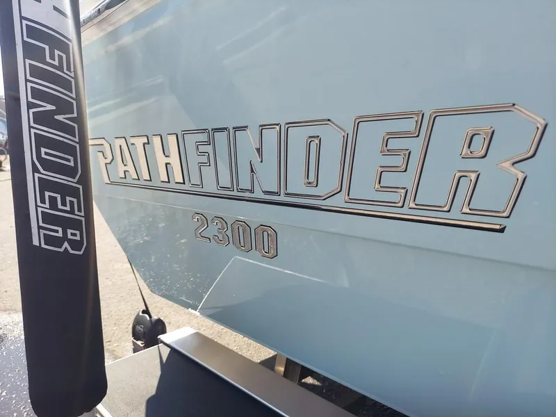 Slide: The Image of 2023 Pathfinder 2300 HPS boat logo on hull, close-up view. - 7