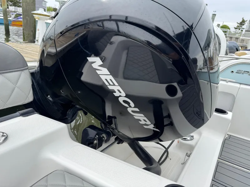 Slide: The Image of 2013 Boston Whaler 210 Montauk with Mercury outboard engine, docked at marina. - 19