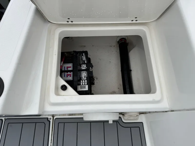 Slide: The Image of Open storage compartment with battery in 2013 Boston Whaler 210 Montauk boat. - 24