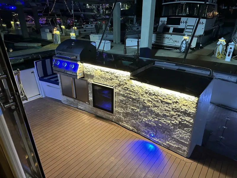 Slide: The Image of Outdoor kitchen on 2004 Cheoy Lee 72 yacht with grill and stone countertop. - 23