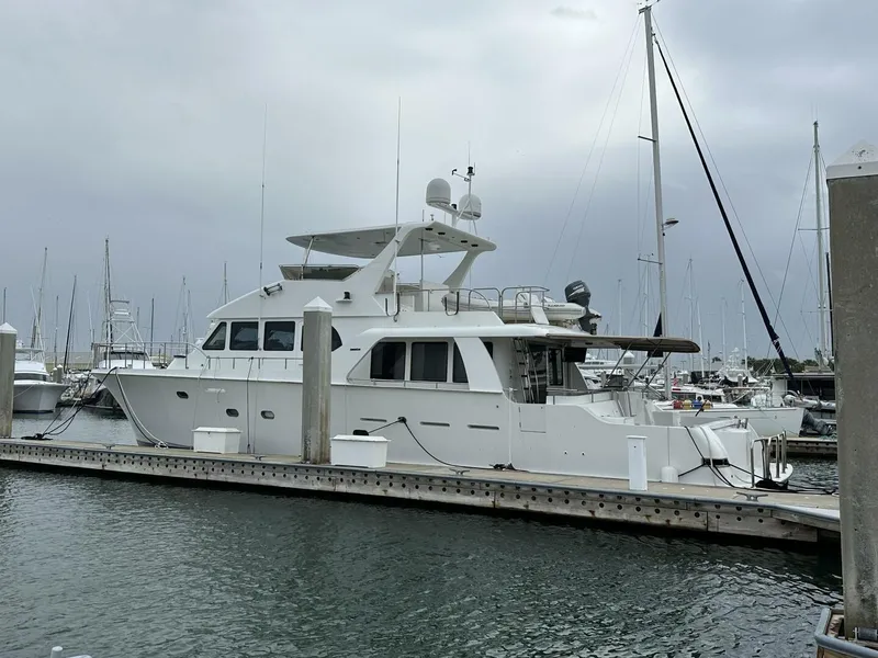 Slide: The Image of Luxury 2004 Cheoy Lee 72 yacht docked at marina under cloudy skies. - 29