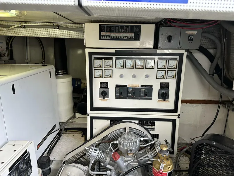 Slide: The Image of Engine room of 2004 Cheoy Lee 72 yacht with control panels and machinery. - 33