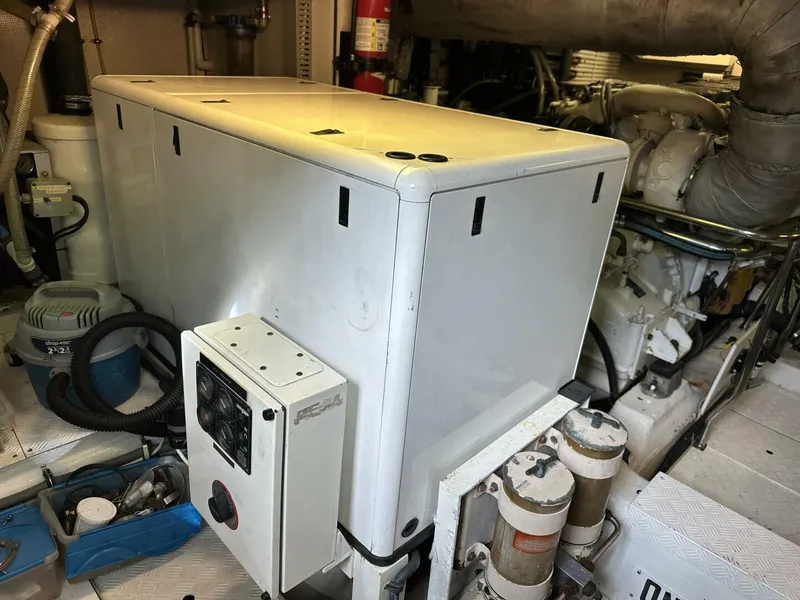 Slide: The Image of Engine room of 2004 Cheoy Lee 72 yacht, featuring machinery and equipment. - 36