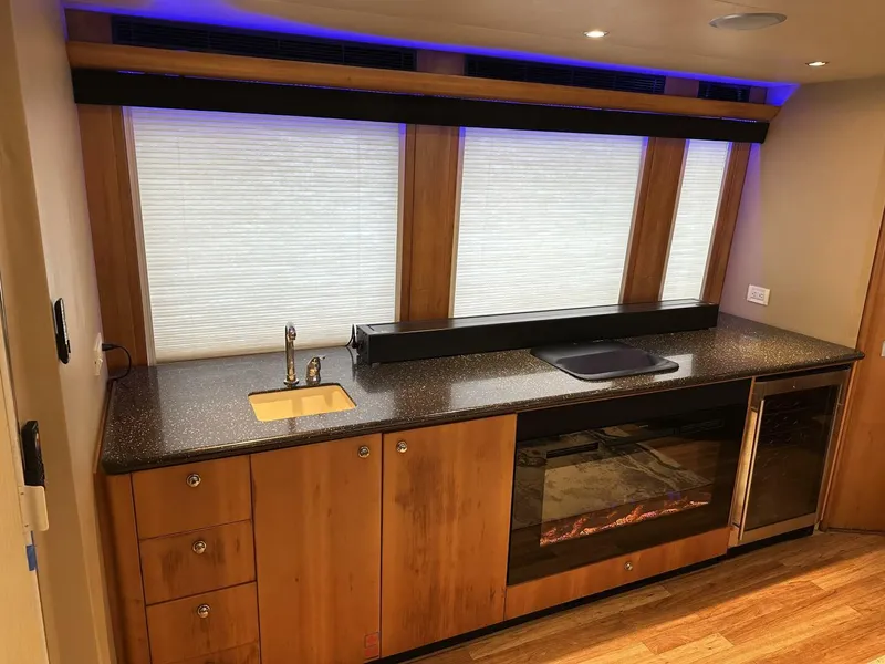 Slide: The Image of Luxurious Cheoy Lee 72 yacht kitchen interior with modern appliances, wood cabinetry, and ambient lighting, 2004 model. - 38