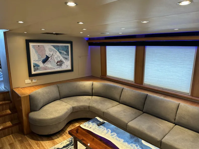 Slide: The Image of Luxurious interior of 2004 Cheoy Lee 72 yacht with curved sofa and nautical decor. - 39