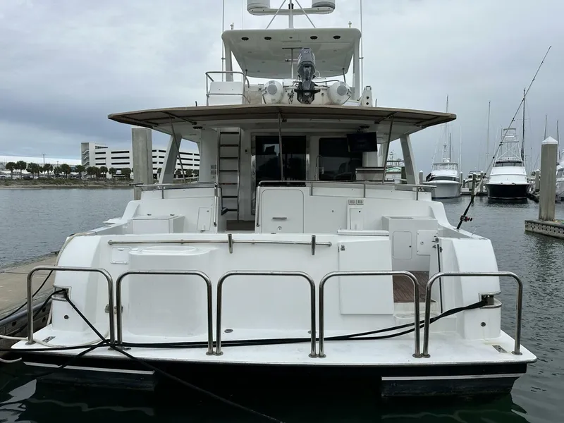 Slide: The Image of 2004 Cheoy Lee 72 yacht docked at marina, rear view. - 4