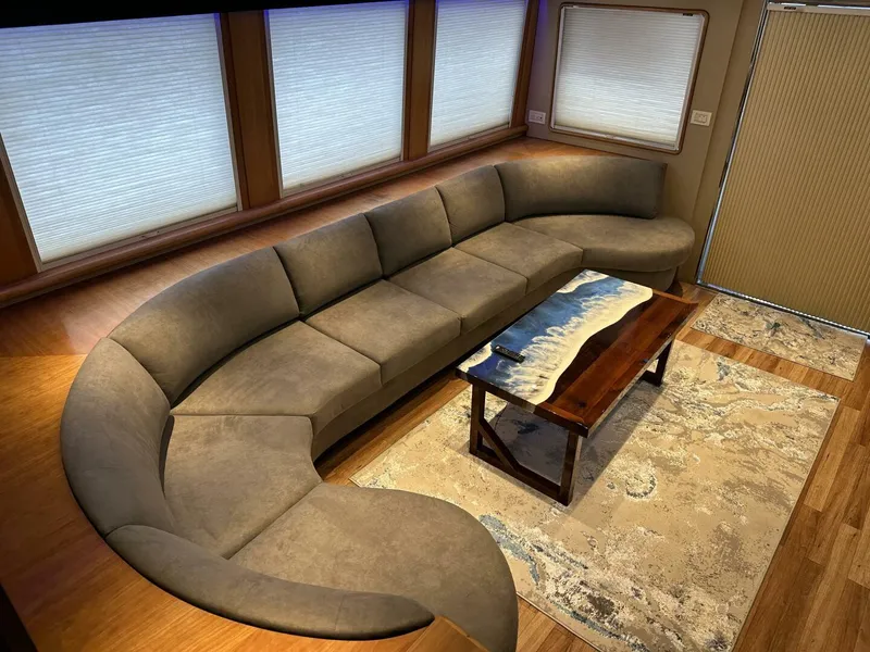 Slide: The Image of Luxurious interior of 2004 Cheoy Lee 72 yacht with curved sofa and elegant coffee table. - 40