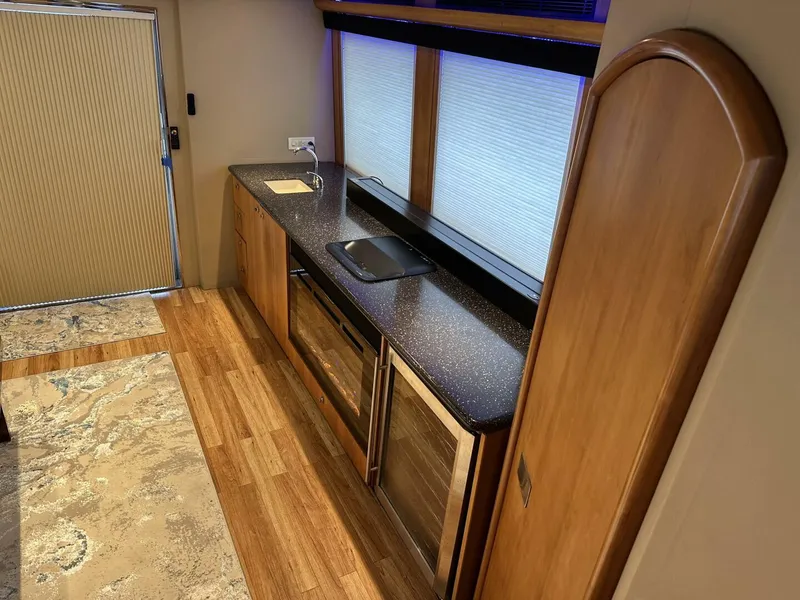Slide: The Image of Luxurious kitchen interior of 2004 Cheoy Lee 72 yacht with modern appliances and wood finishes. - 41