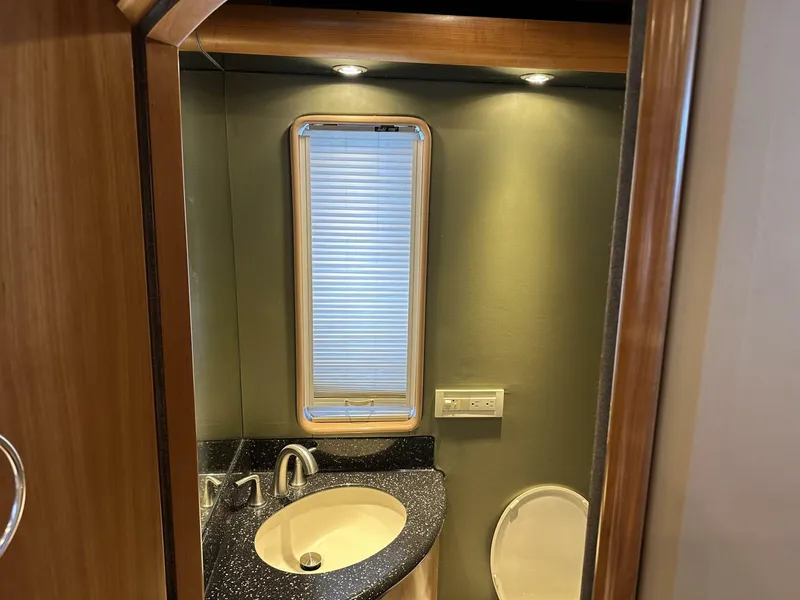 Slide: The Image of Luxurious bathroom in 2004 Cheoy Lee 72 yacht with modern fixtures and elegant design. - 42