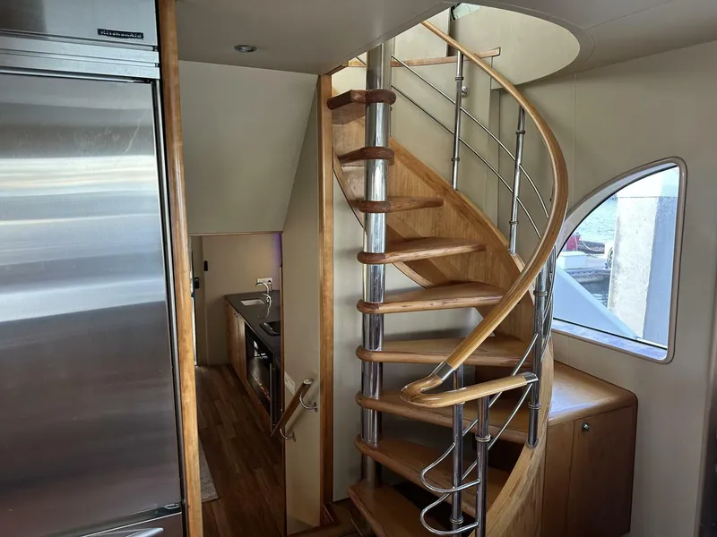 Slide: The Image of Interior of 2004 Cheoy Lee 72 yacht with elegant spiral staircase and modern kitchen. - 44