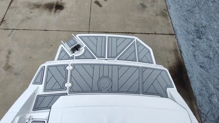 Slide: The Image of 2025 Monterey M-22 boat deck with gray non-slip surface on concrete. - 10