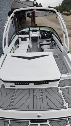 Slide: The Image of 2025 Monterey M-22 boat with sleek design and modern interior, docked outdoors. - 11