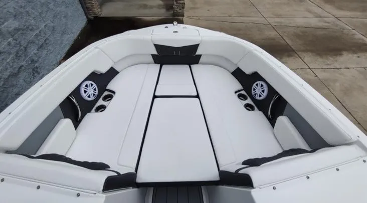 Slide: The Image of 2025 Monterey M-22 boat interior with white seating and built-in speakers. - 3