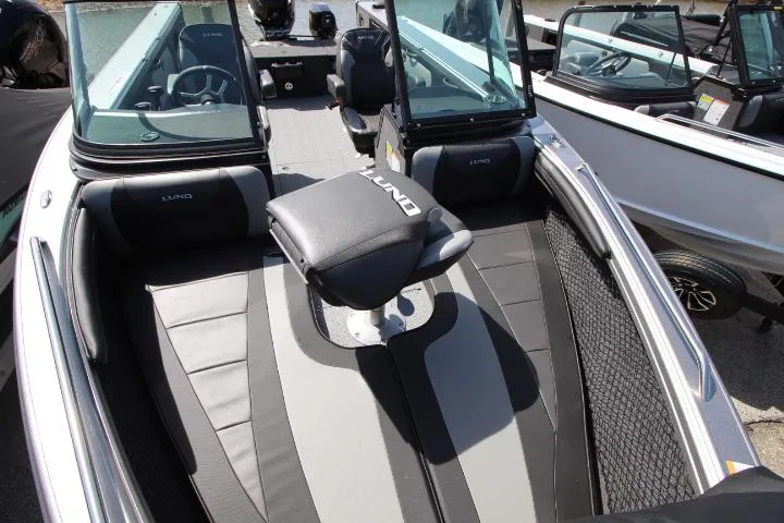Slide: The Image of 2025 Lund 2075 Tyee boat interior with seating and windshield. - 6