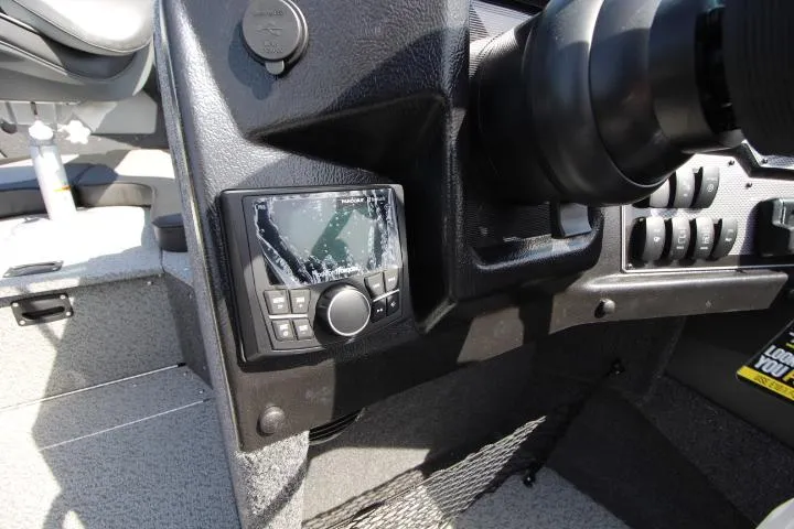Slide: The Image of Dashboard of 2025 Lund 2075 Tyee boat with navigation controls and steering wheel. - 8