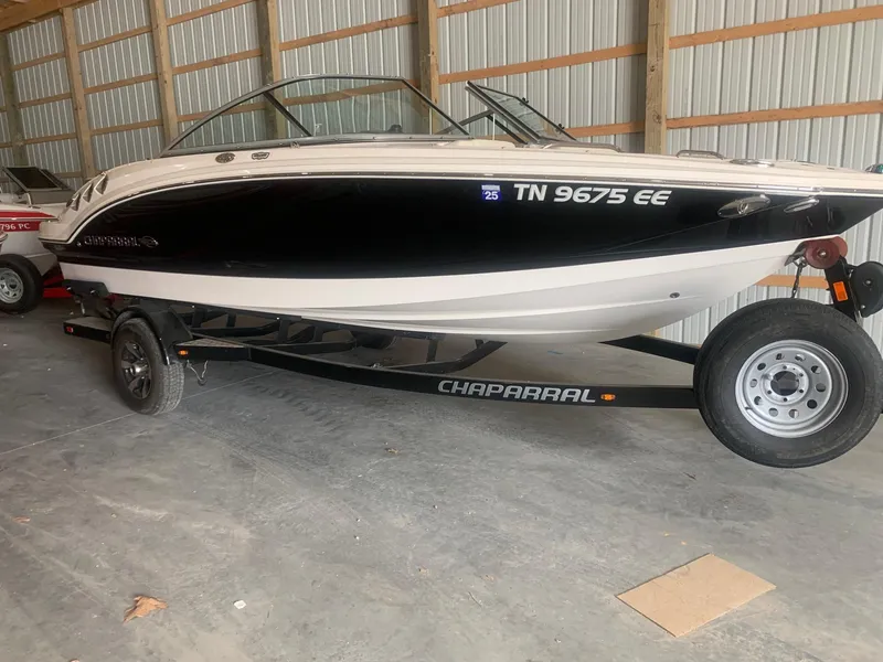 The Image of 2013 Chaparral 206 SSi boat on trailer in storage facility. - 0