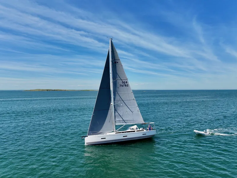The Image of 2019 X-Yachts X4⁶ sailing on open sea under clear blue sky. - 0