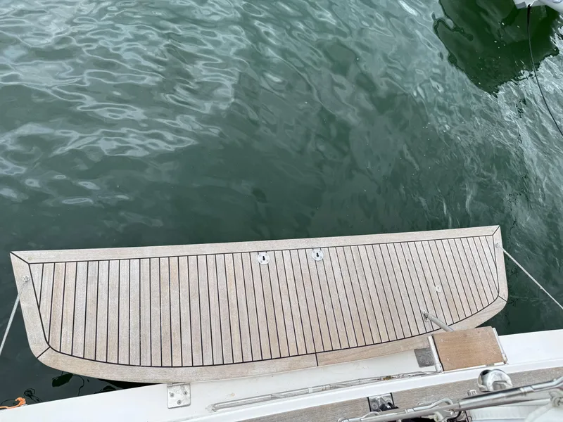 Slide: The Image of 2019 X-Yachts X4⁶ swim platform over calm water. - 12