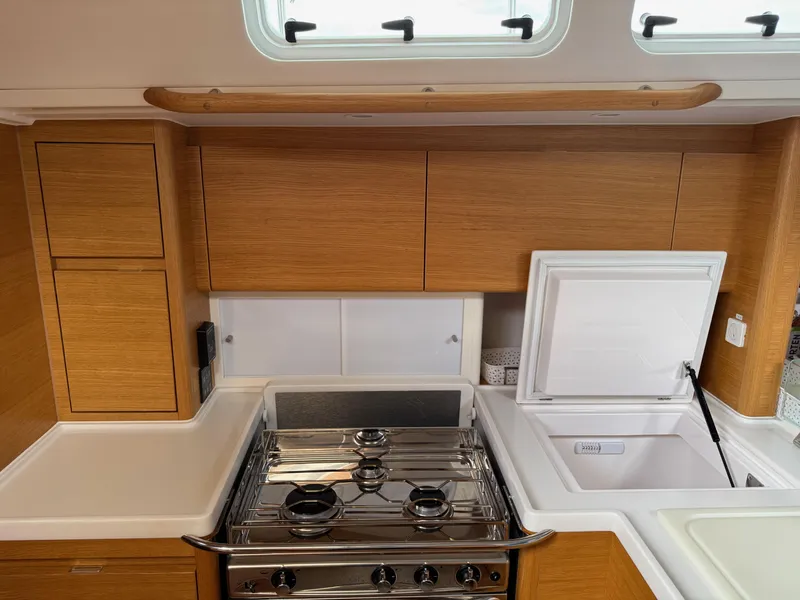 Slide: The Image of Modern kitchen in 2019 X-Yachts X4⁶ sailboat with stove and storage. - 18