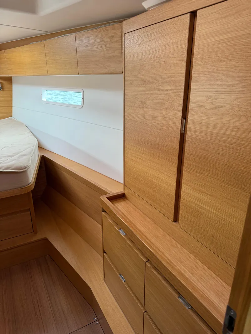 Slide: The Image of 2019 X-Yachts X4⁶ interior with wooden cabinetry and bed. - 20