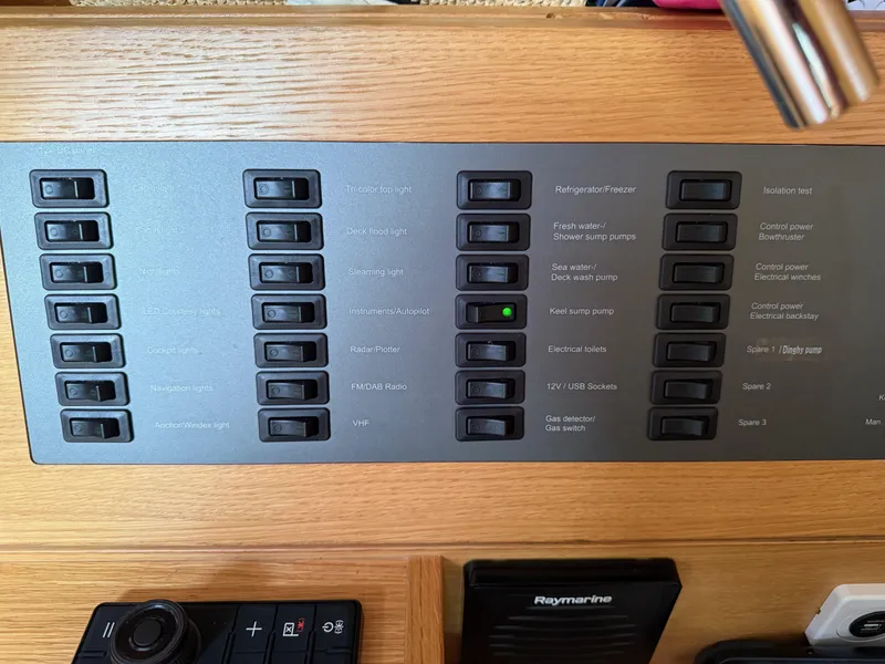 Slide: The Image of Control panel of a 2019 X-Yachts X4⁶ sailboat with labeled switches. - 23